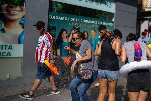 July 19, 2026, Madrid, Madrid, Spain: MADRID, SPAIN Ã¢â‚¬ JULY 19, 2026: People take part in the annual Water Battle in the working-class neighborhood of Vallecas, Madrid. The tradition began in 1981 as residents sought relief from the summer heat and is now held as part of the festivities honoring the Virgen del Carmen, the patron saint of sailors. JNA Press Madrid Spain  - ZUMAq101 20260719_zna_q101_255 Copyright: xC.xCarvajalx