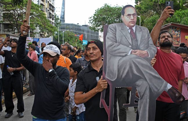 _Cockroach Janata Party (CJP) supporters protest in Mumbai, India - 19 Jul 2026 A protestor holds a cutout of Dr.Babasaheb Ambedkar during a demonstration in support of Sonam Wangchuk demanding resignation of Indian Education Minister Dharmendra Pradhan. Climate activist and education reformer Sonam Wangchuk went on a indefinite hunger strike at Delhi s Jantar Mantar to protest against the Indian government and demand the resignation of Indian Education Minister Dharmendra Pradhan following massive exam irregularities and paper leaks in medical entrance exams. Mumbai India Copyright: xAshishxVaishnavx xSOPAxImagesx AVaishnav_Cockroach Janata Party (CJP) supporters protest in Mumbai (4)