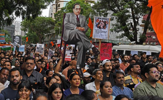 _Cockroach Janata Party (CJP) supporters protest in Mumbai, India - 19 Jul 2026 A protestor (c) holds a cutout of Dr.Babasaheb Ambedkar during a demonstration in support of Sonam Wangchuk demanding resignation of Indian Education Minister Dharmendra Pradhan. Climate activist and education reformer Sonam Wangchuk went on a indefinite hunger strike at Delhi s Jantar Mantar to protest against the Indian government and demand the resignation of Indian Education Minister Dharmendra Pradhan following massive exam irregularities and paper leaks in medical entrance exams. Mumbai India Copyright: xAshishxVaishnavx xSOPAxImagesx AVaishnav_Cockroach Janata Party (CJP) supporters protest in Mumbai (7)