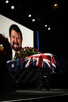 DERRYN HINCH STATE FUNERAL, The stage and coffin of Derryn Hinch during a State Funeral Service for Derryn Hinch at the Timber Yard, Melbourne, Monday, July 20, 2026. . Outspoken media figure and former senator Derryn Hinch has died at the age of 82 after a long and public health battle. ( NO ARCHIVING MELBOURNE VICTORIA AUSTRALIA  Copyright: xCHRISTOPHERxHOPKINSx 20260720133880200850