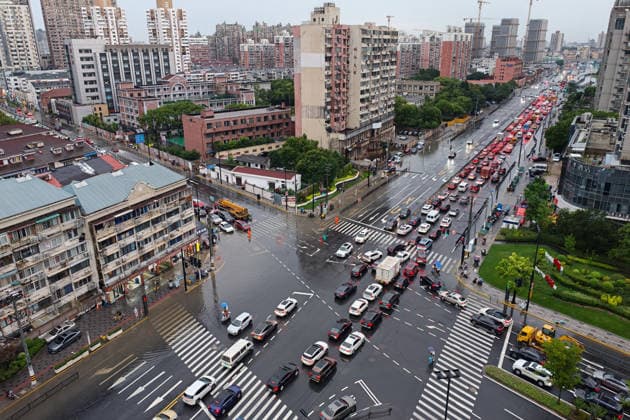 SHANGHAI, CHINA - JULY 19: Cars drive through flooded street due to heavy rainstorms on July 19, 2026 in Shanghai, China. Shanghai Meteorological Observatory upgraded the rainstorm alert from yellow to orange for the central urban area at 14:35 on July 19.  Copyright: xVCGx 111655213997