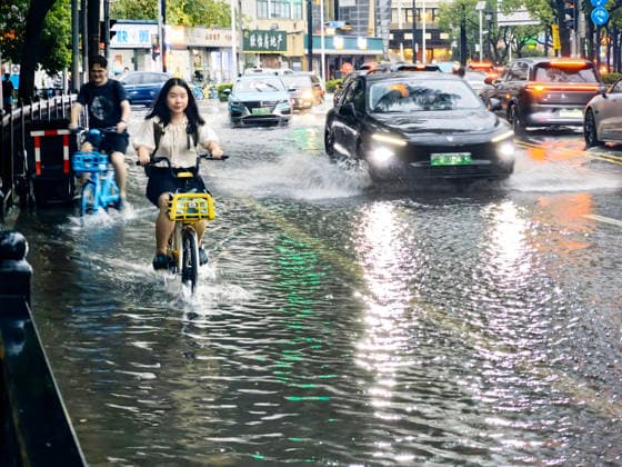 SHANGHAI, CHINA - JULY 19: Cars drive through flooded street due to heavy rainstorms on July 19, 2026 in Shanghai, China. Heavy rain caused severe waterlogging in roads and residential areas in Shanghai s Yangpu District. Shanghai Meteorological Observatory upgraded the rainstorm alert from yellow to orange for the central urban area at 14:35 on July 19.  Copyright: xVCGx 111655264430