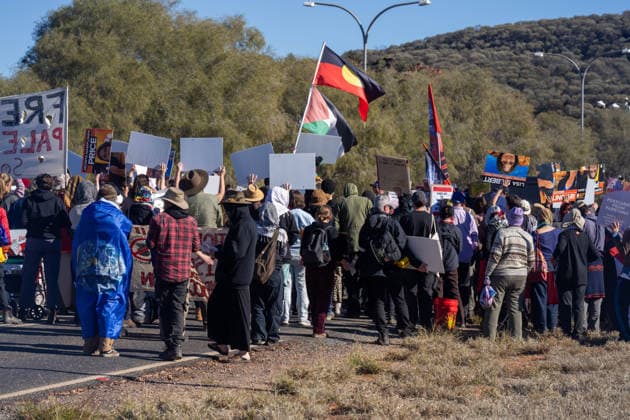 CLOSE PINE GAP PROTEST ALICE SPRINGS, Hundreds of protesters convoy during the three-day Close Pine Gap symposium in Alice Springs, Northern Territory, Monday, July 20, 2026. Those gathered are calling for the closure of the US military intelligence base Pine Gap, for an end to the US alliance, and for the sacred land the base occupies to be returned to Arrernte custodians, who never consented to the base. ( NO ARCHIVING ALICE SPRINGS NORTHERN TERRITORY AUSTRALIA  Copyright: xRHETTxHAMMERTONx 20260720146006893226