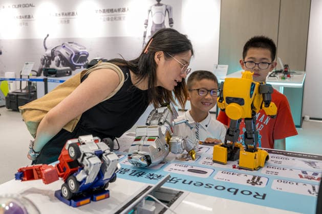 KUNSHAN, CHINA - JULY 19: People visit a robot 6S store on its opening day on July 19, 2026 in Kunshan, Jiangsu Province of China. The store offers integrated sales, spare parts, after-sales service, feedback, leasing, and customization services while serving as a hub for humanoid robots, drones, training, and industry incubation.  Copyright: xVCGx 111655192686