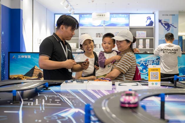 KUNSHAN, CHINA - JULY 19: People visit a robot 6S store on its opening day on July 19, 2026 in Kunshan, Jiangsu Province of China. The store offers integrated sales, spare parts, after-sales service, feedback, leasing, and customization services while serving as a hub for humanoid robots, drones, training, and industry incubation.  Copyright: xVCGx 111655192667
