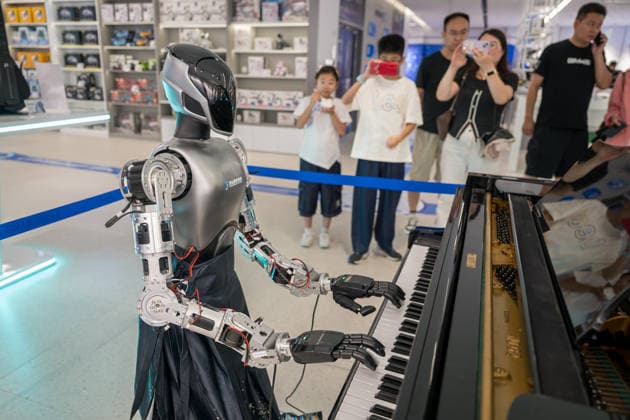 KUNSHAN, CHINA - JULY 19: People visit a robot 6S store on its opening day on July 19, 2026 in Kunshan, Jiangsu Province of China. The store offers integrated sales, spare parts, after-sales service, feedback, leasing, and customization services while serving as a hub for humanoid robots, drones, training, and industry incubation.  Copyright: xVCGx 111655192656