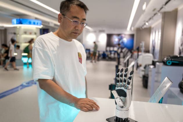 KUNSHAN, CHINA - JULY 19: People visit a robot 6S store on its opening day on July 19, 2026 in Kunshan, Jiangsu Province of China. The store offers integrated sales, spare parts, after-sales service, feedback, leasing, and customization services while serving as a hub for humanoid robots, drones, training, and industry incubation.  Copyright: xVCGx 111655192657