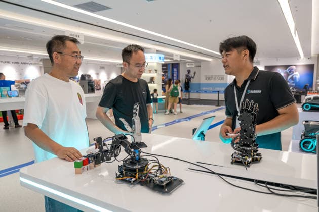 KUNSHAN, CHINA - JULY 19: People visit a robot 6S store on its opening day on July 19, 2026 in Kunshan, Jiangsu Province of China. The store offers integrated sales, spare parts, after-sales service, feedback, leasing, and customization services while serving as a hub for humanoid robots, drones, training, and industry incubation.  Copyright: xVCGx 111655192658