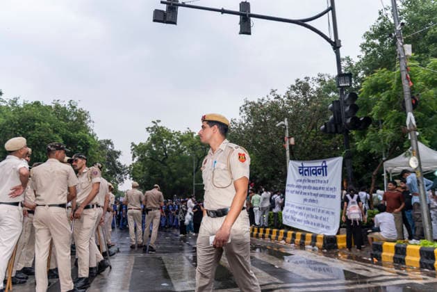 July 20, 2026, New Delhi, Delhi, India: Supporters of India s Cockroach Janta Party (CJP) gather before a march to Parliament during a protest demanding the resignation of Education Minister Dharmendra Pradhan over alleged exam paper leaks. Members of the Rapid Action Force (RAF) are deployed at the protest site near Jantar Mantar in New Delhi, India. New Delhi India  - ZUMAt180 20260720_zip_t180_002 Copyright: xJaixThakurx