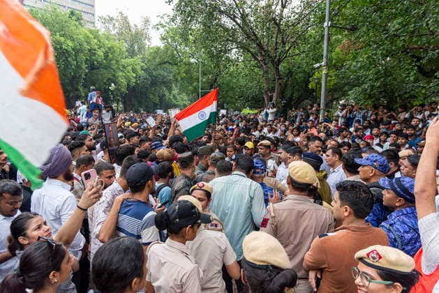 July 20, 2026, New Delhi, Delhi, India: Supporters of India s Cockroach Janta Party (CJP) gather before a march to Parliament during a protest demanding the resignation of Education Minister Dharmendra Pradhan over alleged exam paper leaks. Members of the Rapid Action Force (RAF) are deployed at the protest site near Jantar Mantar in New Delhi, India. New Delhi India  - ZUMAt180 20260720_zip_t180_004 Copyright: xJaixThakurx