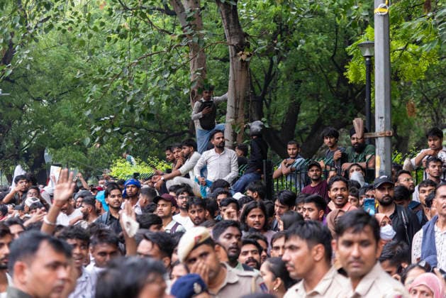 July 20, 2026, New Delhi, Delhi, India: Supporters of India s Cockroach Janta Party (CJP) gather before a march to Parliament during a protest demanding the resignation of Education Minister Dharmendra Pradhan over alleged exam paper leaks. Members of the Rapid Action Force (RAF) are deployed at the protest site near Jantar Mantar in New Delhi, India. New Delhi India  - ZUMAt180 20260720_zip_t180_007 Copyright: xJaixThakurx