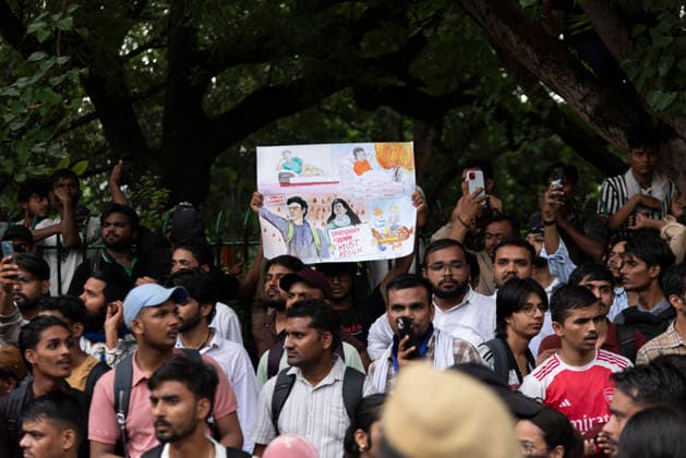 July 20, 2026, New Delhi, Delhi, India: Supporters of India s Cockroach Janta Party (CJP) gather before a march to Parliament during a protest demanding the resignation of Education Minister Dharmendra Pradhan over alleged exam paper leaks. Members of the Rapid Action Force (RAF) are deployed at the protest site near Jantar Mantar in New Delhi, India. New Delhi India - ZUMAt180 20260720_zip_t180_010 Copyright: xJaixThakurx