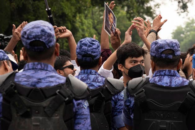 July 20, 2026, New Delhi, Delhi, India: Supporters of India s Cockroach Janta Party (CJP) gather before a march to Parliament during a protest demanding the resignation of Education Minister Dharmendra Pradhan over alleged exam paper leaks. Members of the Rapid Action Force (RAF) are deployed at the protest site near Jantar Mantar in New Delhi, India. New Delhi India - ZUMAt180 20260720_zip_t180_013 Copyright: xJaixThakurx