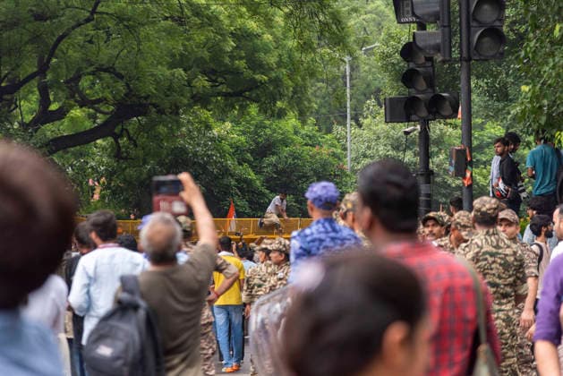 July 20, 2026, New Delhi, Delhi, India: Supporters of India s Cockroach Janta Party (CJP) gather before a march to Parliament during a protest demanding the resignation of Education Minister Dharmendra Pradhan over alleged exam paper leaks. Members of the Rapid Action Force (RAF) are deployed at the protest site near Jantar Mantar in New Delhi, India. New Delhi India - ZUMAt180 20260720_zip_t180_016 Copyright: xJaixThakurx
