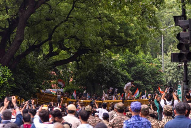July 20, 2026, New Delhi, Delhi, India: Supporters of India s Cockroach Janta Party (CJP) gather before a march to Parliament during a protest demanding the resignation of Education Minister Dharmendra Pradhan over alleged exam paper leaks. Members of the Rapid Action Force (RAF) are deployed at the protest site near Jantar Mantar in New Delhi, India. New Delhi India - ZUMAt180 20260720_zip_t180_019 Copyright: xJaixThakurx