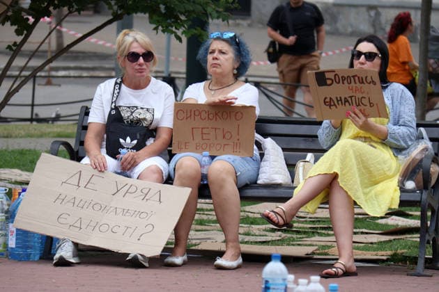 Day Four of protest action against dismissal of Mykhailo Fedorov in Kyiv Three women with placards sit on the bench during a protest action against the dismissal of Ukrainian Defence Minister Mykhailo Fedorov in Ivana Franka Square outside the Ivan Franko National Academic Drama Theatre and near the Office of the President, Kyiv, Ukraine, July 19, 2026., Credit:Pavlo Bahmut Ukrinform Avalon Ukraine, Kyiv  Copyright: xPavloxBahmutx xUkrinformx xAvalonx 1117513139