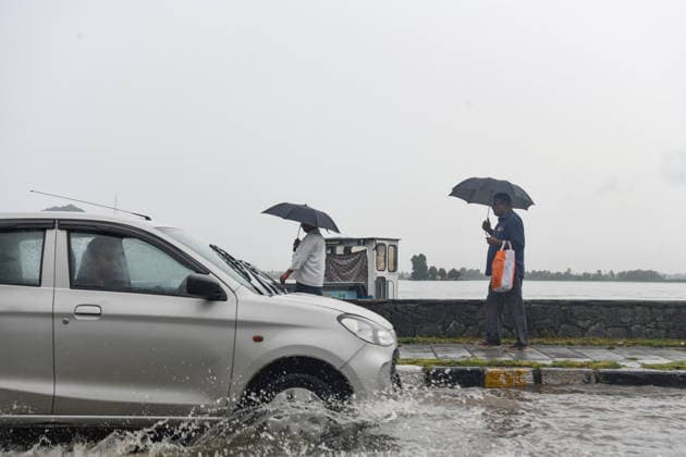 July 20, 2026, Srinagar, Jammu And Kashmir, India: People walk witn their umbrellas during heavy rainfall in Srinagar.Torrential rain unleashed flash floods and landslides in Pir Panjal region of J&Ks Poonch and Rajouri districts Sunday, killing at least 14 people, leaving several missing and burying homes under walls of water, rock and mud that barrelled down mountain slopes. Officials said the toll could rise as rescuers searched for those trapped beneath debris. Srinagar India - ZUMAz120 20260720_zip_z120_010 Copyright: xBasitxZargarx
