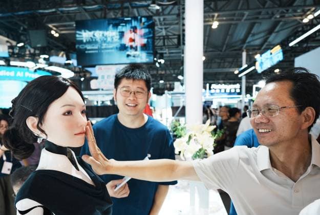 2026 WAIC Held in Shanghai Viewers touch the biomimetic skin of a beautiful robot at the 2026 World Artificial Intelligence Conference in Shanghai, China on July 20, 2026. Shanghai Shanghai China  Copyright: xCFOTOx i1784570728385