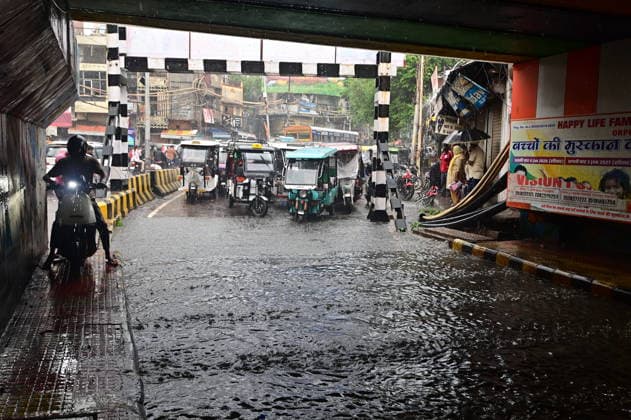 July 20, 2026, Prayagraj, Uttar Pradesh, India: Prayagraj: Vehicle ply trough a waterlogged railway under pass after heavy rain, in Prayagraj on Monday, July 20, 2026. Prayagraj India - ZUMAv115 20260720_zap_v115_015 Copyright: xPrabhatxKumarxVermax