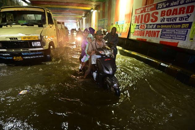 July 20, 2026, Prayagraj, Uttar Pradesh, India: Prayagraj: Vehicle ply trough a waterlogged railway under pass after heavy rain, in Prayagraj on Monday, July 20, 2026. Prayagraj India - ZUMAv115 20260720_zap_v115_017 Copyright: xPrabhatxKumarxVermax
