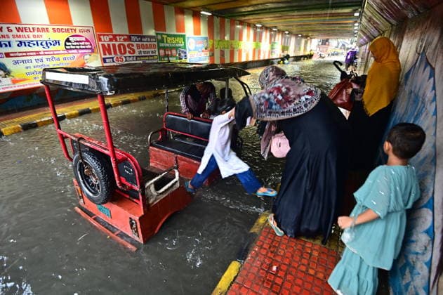 July 20, 2026, Prayagraj, Uttar Pradesh, India: Prayagraj: Vehicle ply trough a waterlogged railway under pass after heavy rain, in Prayagraj on Monday, July 20, 2026. Prayagraj India - ZUMAv115 20260720_zap_v115_020 Copyright: xPrabhatxKumarxVermax