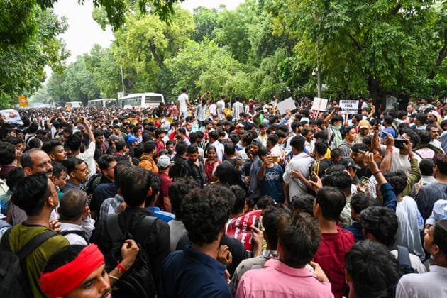 NEW DELHI, INDIA - JULY 20: Supporters of the Cockroach Janta Party (CJP) gather in large numbers and breach security barricades on Raisina Road during a protest march towards Parliament House on July 20, 2026 in New Delhi, India. The protesters were demanding the resignation of Union Education Minister Dharmendra Pradhan over alleged examination irregularities. (Photo by Ajay Aggarwal Hindustan Times) Delhi Police Use Lathi Charge And Tear Gas Shells To Disperse CJP Supporters During Their March To Parliament
