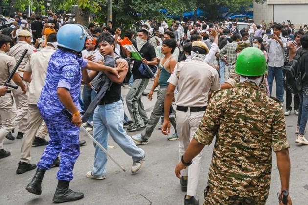 NEW DELHI, INDIA - JULY 20: Delhi Police carry out a mild lathi-charge to disperse supporters of the Cockroach Janta Party (CJP) after they gather in large numbers and breach security barricades near Parliament House on DR Rajendra Prasad Road on July 20, 2026 in New Delhi, India. The protesters were demanding the resignation of Union Education Minister Dharmendra Pradhan over alleged examination irregularities. (Photo by Ajay Aggarwal Hindustan Times) Delhi Police Use Lathi Charge And Tear Gas Shells To Disperse CJP Supporters During Their March To Parliament