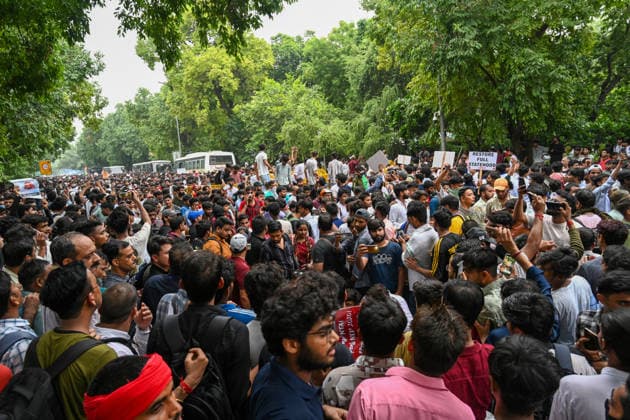 NEW DELHI, INDIA - JULY 20: Supporters of the Cockroach Janta Party (CJP) gather in large numbers and breach security barricades on Raisina Road during a protest march towards Parliament House on July 20, 2026 in New Delhi, India. The protesters were demanding the resignation of Union Education Minister Dharmendra Pradhan over alleged examination irregularities. (Photo by Ajay Aggarwal Hindustan Times) Delhi Police Use Lathi Charge And Tear Gas Shells To Disperse CJP Supporters During Their March To Parliament