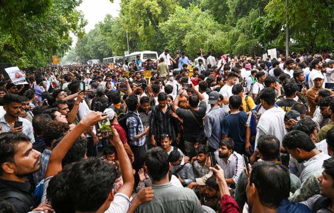 NEW DELHI, INDIA - JULY 20: Supporters of the Cockroach Janta Party (CJP) gather in large numbers and breach security barricades on Raisina Road during a protest march towards Parliament House on July 20, 2026 in New Delhi, India. The protesters were demanding the resignation of Union Education Minister Dharmendra Pradhan over alleged examination irregularities. (Photo by Ajay Aggarwal Hindustan Times) Delhi Police Use Lathi Charge And Tear Gas Shells To Disperse CJP Supporters During Their March To Parliament