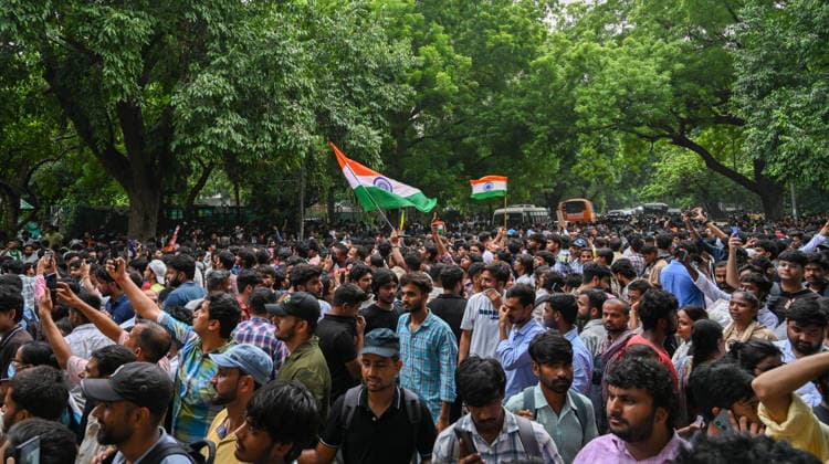 NEW DELHI, INDIA - JULY 20: Supporters of the Cockroach Janta Party (CJP) gather in large numbers and breach security barricades on Raisina Road during a protest march towards Parliament House on July 20, 2026 in New Delhi, India. The protesters were demanding the resignation of Union Education Minister Dharmendra Pradhan over alleged examination irregularities. (Photo by Ajay Aggarwal Hindustan Times) Delhi Police Use Lathi Charge And Tear Gas Shells To Disperse CJP Supporters During Their March To Parliament