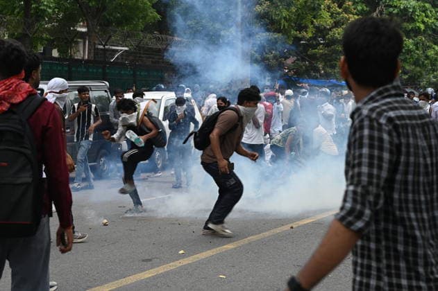 NEW DELHI, INDIA - JULY 20: Delhi Police use tear gas to disperse supporters of the Cockroach Janta Party (CJP) after they gather in large numbers and breach security barricades on DR Rajendra Prasad Road near Parliament House on July 20, 2026 in New Delhi, India. The protesters were demanding the resignation of Union Education Minister Dharmendra Pradhan over alleged examination irregularities. (Photo by Ajay Aggarwal Hindustan Times) Delhi Police Use Lathi Charge And Tear Gas Shells To Disperse CJP Supporters During Their March To Parliament