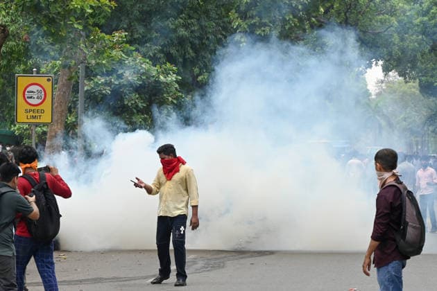 NEW DELHI, INDIA - JULY 20: Delhi Police use tear gas to disperse supporters of the Cockroach Janta Party (CJP) after they gather in large numbers and breach security barricades on DR Rajendra Prasad Road near Parliament House on July 20, 2026 in New Delhi, India. The protesters were demanding the resignation of Union Education Minister Dharmendra Pradhan over alleged examination irregularities. (Photo by Ajay Aggarwal Hindustan Times) Delhi Police Use Lathi Charge And Tear Gas Shells To Disperse CJP Supporters During Their March To Parliament