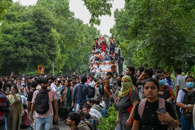 NEW DELHI, INDIA - JULY 20: Supporters of the Cockroach Janta Party (CJP) gather in large numbers and breach security barricades on Raisina Road during a protest march towards Parliament House on July 20, 2026 in New Delhi, India. The protesters were demanding the resignation of Union Education Minister Dharmendra Pradhan over alleged examination irregularities. (Photo by Ajay Aggarwal Hindustan Times) Delhi Police Use Lathi Charge And Tear Gas Shells To Disperse CJP Supporters During Their March To Parliament