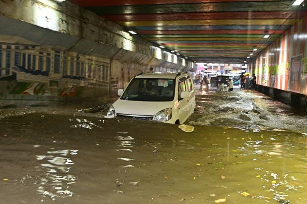 July 20, 2026, Prayagraj, Uttar Pradesh, India: Prayagraj: Vehicle ply trough a waterlogged railway under pass after heavy rain, in Prayagraj on Monday, July 20, 2026. Prayagraj India - ZUMAv115 20260720_zap_v115_030 Copyright: xPrabhatxKumarxVermax