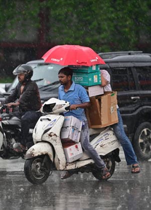 July 20, 2026, Prayagraj, Uttar Pradesh, India: Prayagraj: Commuter use an umbrella during Rain, in Prayagraj on Monday, July 20, 2026. Prayagraj India - ZUMAv115 20260720_zap_v115_036 Copyright: xPrabhatxKumarxVermax