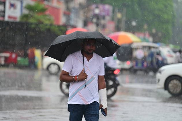 July 20, 2026, Prayagraj, Uttar Pradesh, India: Prayagraj: A man walks with an umbrella during Rain, in Prayagraj on Monday, July 20, 2026. Prayagraj India - ZUMAv115 20260720_zap_v115_038 Copyright: xPrabhatxKumarxVermax