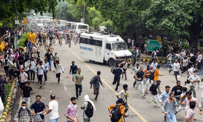 Security personnel fire tear gas shells at protesters near Jantar Mantar New Delhi, Jul 20 (ANI): Protesters run after security personnel fire tear gas shells during the protest by Cockroach Janta Party near Jantar Mantar, in New Delhi on Monday. New Delhi Delhi India Copyright: xANIx ANI_20260720532