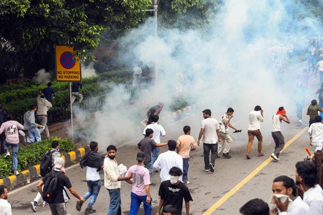 Security personnel fire tear gas shells at protesters near Jantar Mantar New Delhi, Jul 20 (ANI): Protesters run after security personnel fire tear gas shells during the protest by Cockroach Janta Party near Jantar Mantar, in New Delhi on Monday. New Delhi Delhi India Copyright: xANIx ANI_20260720533