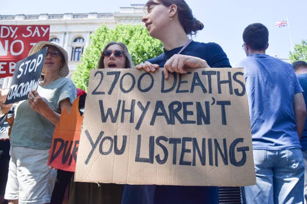 July 20, 2026, London, England, United Kingdom: A protester holds a 2700 deaths sign as climate activists from the group Fossil Free London stage a protest outside Downing Street against Rosebank and other oil and gas projects in the North Sea ahead of the arrival of Andy Burnham, who replaces Keir Starmer as the UK Prime Minister. London United Kingdom - ZUMAv130 20260720_zip_v130_025 Copyright: xVukxValcicx