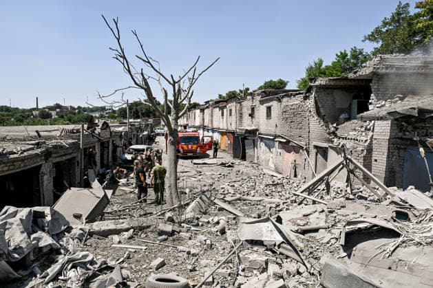 A fire engine is parked at a garage cooperative hit by a Russian guided aerial bomb strike in the Voznesenivskyi district of Zaporizhzhia, Ukraine, July 20, 2026. The attack destroyed or damaged privately owned garages, while the blast wave and debris wrecked civilian cars. A woman was killed at the site of the strike, and five others were injured. (Photo by Dmytro Smolienko Ukrinform) Russian strike garage co-op in central Zaporizhzhia with guided bomb  Copyright: xDmytroxSmolienkox