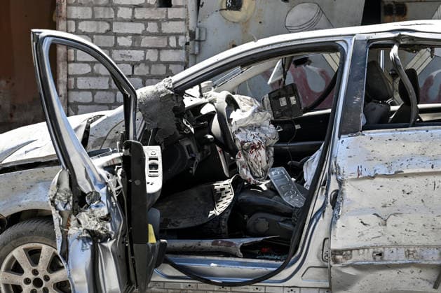 Blood stains cover an airbag inside a car damaged by a Russian guided aerial bomb strike on a garage cooperative in the Voznesenivskyi district of Zaporizhzhia, Ukraine, July 20, 2026. The attack destroyed or damaged privately owned garages, while the blast wave and debris wrecked civilian cars. A woman was killed at the site of the strike, and five others were injured. (Photo by Dmytro Smolienko Ukrinform) Russian strike garage co-op in central Zaporizhzhia with guided bomb  Copyright: xDmytroxSmolienkox