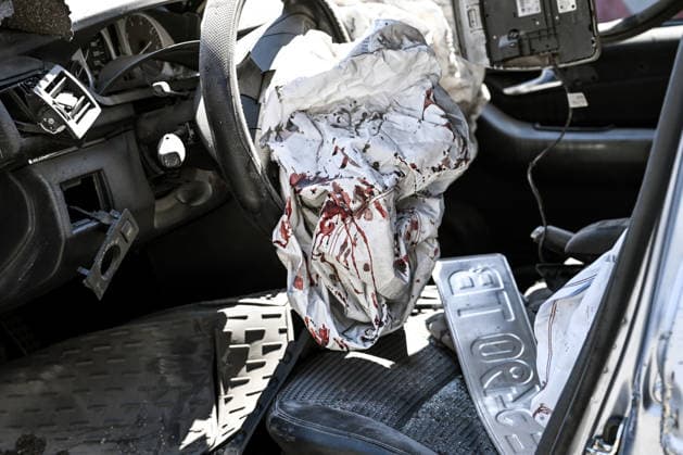 Blood stains cover an airbag inside a car damaged by a Russian guided aerial bomb strike on a garage cooperative in the Voznesenivskyi district of Zaporizhzhia, Ukraine, July 20, 2026. The attack destroyed or damaged privately owned garages, while the blast wave and debris wrecked civilian cars. A woman was killed at the site of the strike, and five others were injured. (Photo by Dmytro Smolienko Ukrinform) Russian strike garage co-op in central Zaporizhzhia with guided bomb  Copyright: xDmytroxSmolienkox