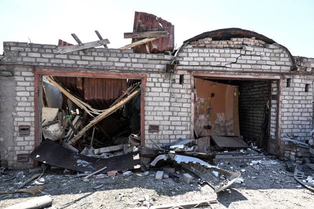 A garage cooperative is damaged by a Russian guided aerial bomb strike in the Voznesenivskyi district of Zaporizhzhia, Ukraine, July 20, 2026. The attack destroyed or damaged privately owned garages, while the blast wave and debris wrecked civilian cars. A woman was killed at the site of the strike, and five others were injured. (Photo by Dmytro Smolienko Ukrinform) Russian strike garage co-op in central Zaporizhzhia with guided bomb  Copyright: xDmytroxSmolienkox