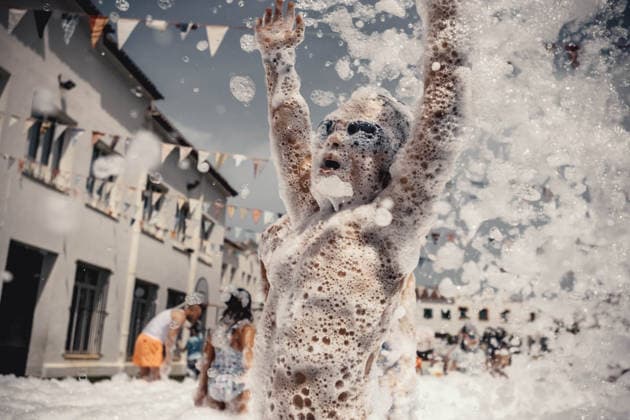 July 20, 2026, Es Mercadal, Menorca Balearic Islands, Spain: Children get covered in foam as they participate in a foam party looking for some refreshment during the traditional Sant Marti Festival in Es Mercadal Es Mercadal Spain - ZUMAo105 20260720_fap_o105_006 Copyright: xMatthiasxOesterlex