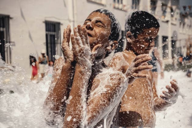 July 20, 2026, Es Mercadal, Menorca Balearic Islands, Spain: Children get covered in foam as they participate in a foam party looking for some refreshment during the traditional Sant Marti Festival in Es Mercadal Es Mercadal Spain - ZUMAo105 20260720_fap_o105_016 Copyright: xMatthiasxOesterlex