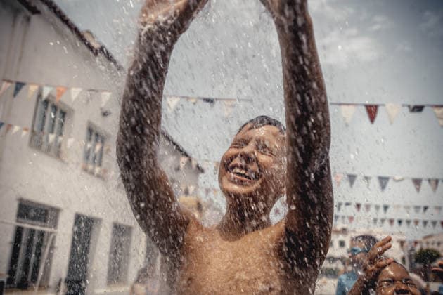 July 20, 2026: Children demand a water shower during a foam party looking for some refreshment during the traditional Sant Marti Festival in Es Mercadal - ZUMAo105 20260720_fap_o105_019 Copyright: xMatthiasxOesterlex