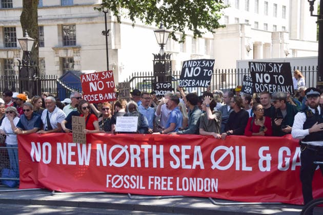 July 20, 2026, London, United Kingdom: Climate activists from the group Fossil Free London stand with placards behind a No new North Sea oil and gas banner during a protest against Rosebank and other oil and gas projects in the North Sea outside Downing Street ahead of the arrival of Andy Burnham, who starts his first day as the new UK Prime Minister replacing Keir Starmer. London United Kingdom - ZUMAs197 20260720_aaa_s197_110 Copyright: xVukxValcicx