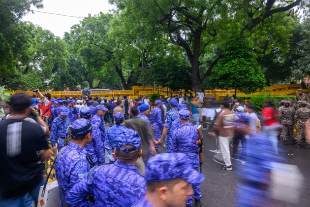 July 20, 2026, New Delhi, New Delhi, India: Caption: NEW DELHI, India Ã¢â‚¬ Rapid Action Force (RAF) personnel walk past a barricade as protesters and other security forces gather at Jantar Mantar during demonstrations by the Cockroach Janata Party (CJP) demanding the resignation of Education Minister Dharmendra Pradhan over alleged irregularities in the NEET-UG exam, July 20, 2026. New Delhi India  - ZUMAm184 20260720_zip_m184_037 Copyright: xAnkitxRoyxMajumderx