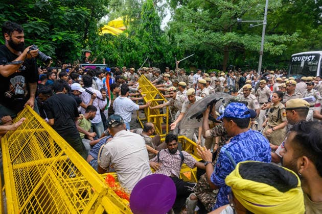 July 20, 2026, New Delhi, New Delhi, India: NEW DELHI, India Ã¢â‚¬ A large contingent of police move in as protesters and officers scuffle at a barricade, with one officer holding a riot shield, at Jantar Mantar during demonstrations by the Cockroach Janata Party (CJP) demanding the resignation of Education Minister Dharmendra Pradhan over alleged irregularities in the NEET-UG exam, July 20, 2026. New Delhi India  - ZUMAm184 20260720_zip_m184_044 Copyright: xAnkitxRoyxMajumderx
