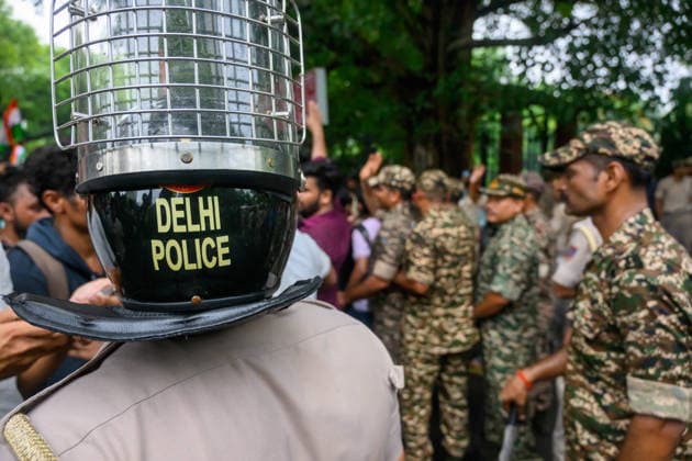 July 20, 2026, New Delhi, New Delhi, India: NEW DELHI, India Ã¢â‚¬ A Delhi Police officer in a riot helmet stands as security personnel gather near Sansad Marg during demonstrations by the Cockroach Janata Party (CJP) demanding the resignation of Education Minister Dharmendra Pradhan over alleged irregularities in the NEET-UG exam, July 20, 2026. New Delhi India  - ZUMAm184 20260720_zip_m184_064 Copyright: xAnkitxRoyxMajumderx